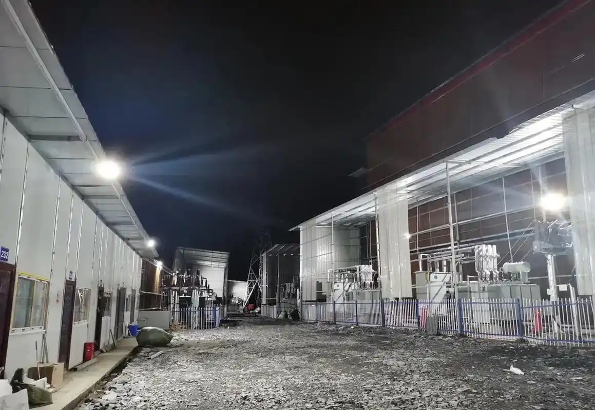 A vast mining farm with rows of mining rigs, highlighting the scale and energy consumption of these operations.
