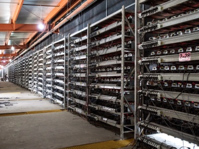 High-capacity mining farm facility with rows of mining machines